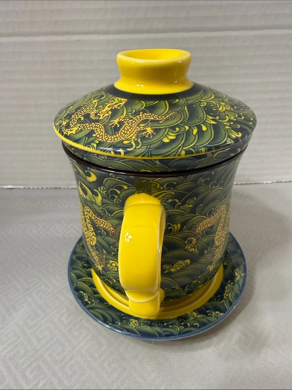 Porcelain Tea Cup Set Lid Saucer and Infuser Chinese Dragon Motif Yellow & Green